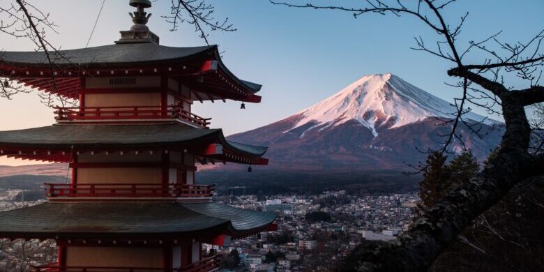 Horizontal shot of the red Chureito Pagoda in Japan, with Fujiyama (Mount Fuji) in the background